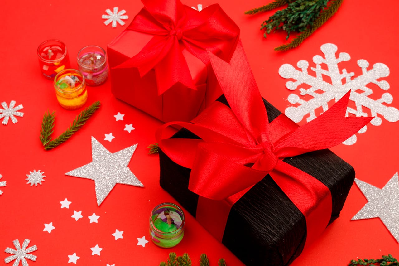 Services Bright holiday gifts wrapped with red ribbons surrounded by festive decorations on a red background.