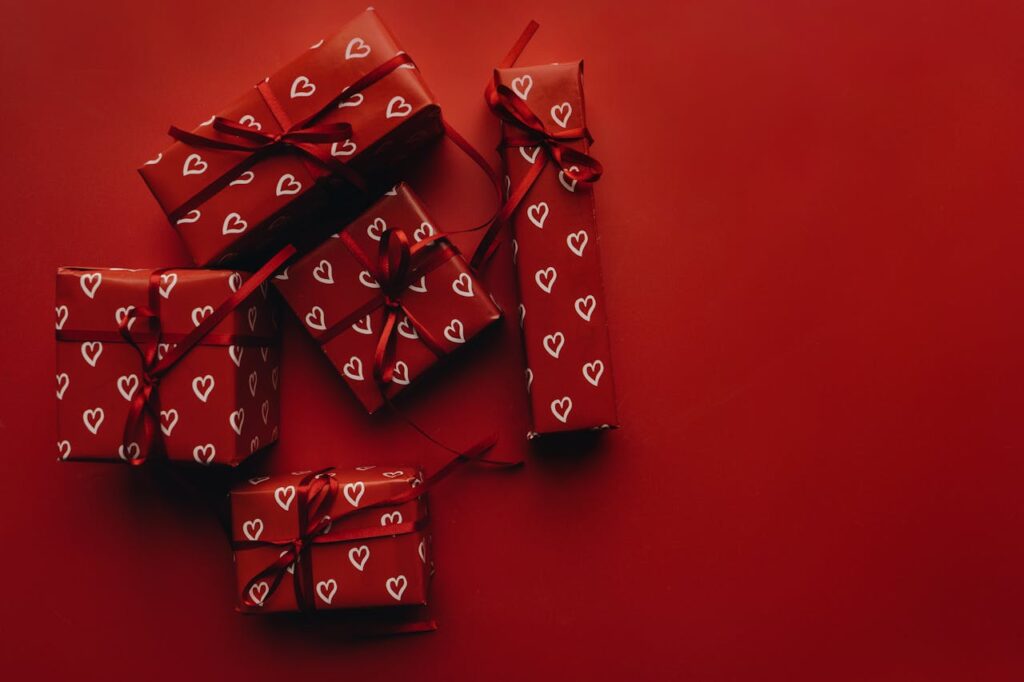 Red wrapped gifts with heart patterns. Perfect for Valentine